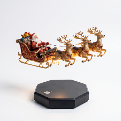 Santa's Floating Sleigh levitating above its magnetic base with a warm golden glow